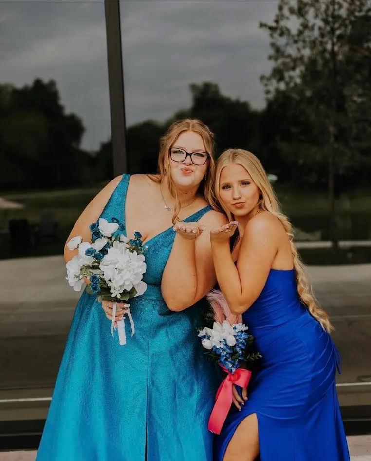 Two friends dressed for a special event